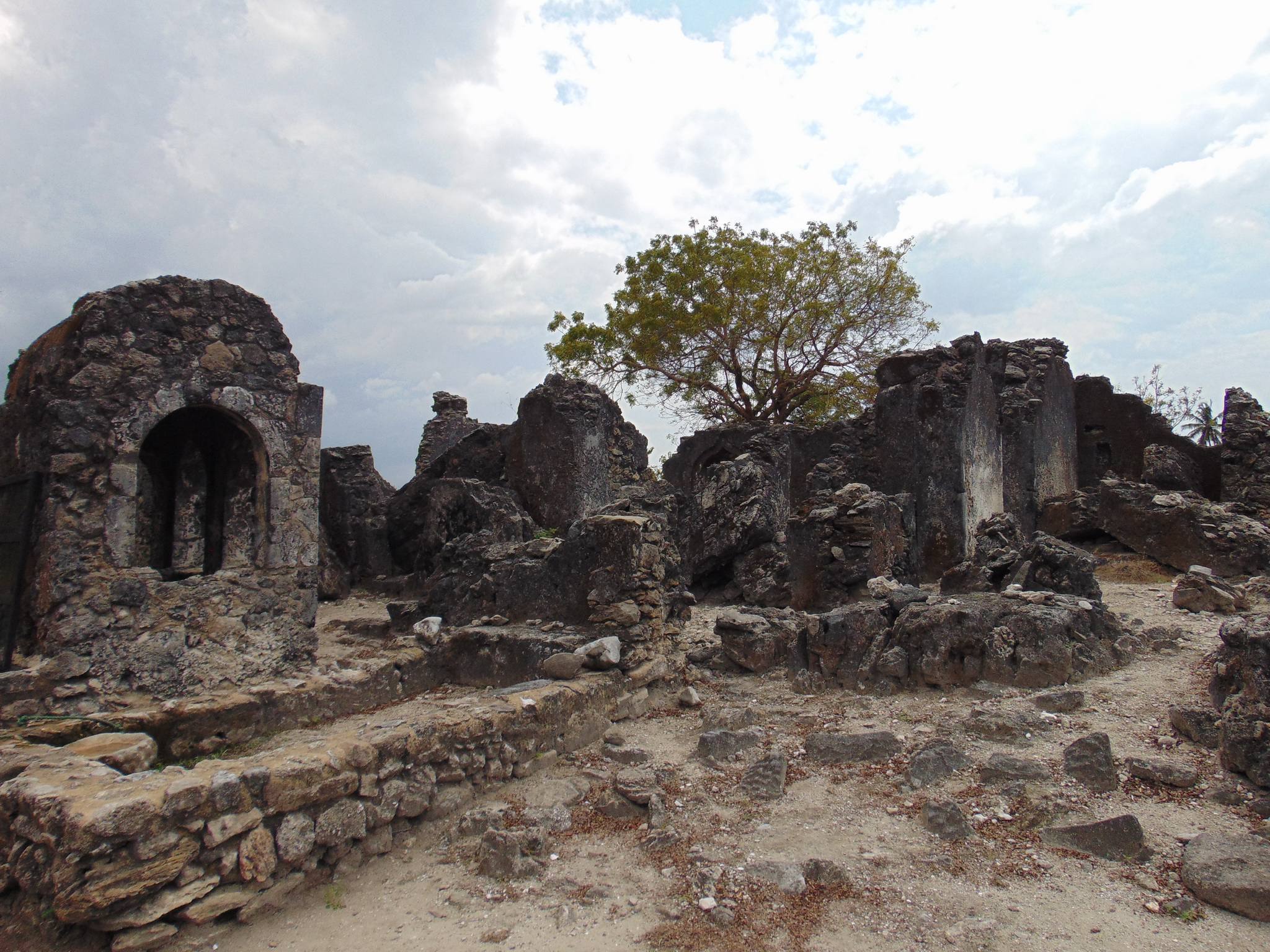 Kaole Ruins at the historic Bagamoyo site in Tanzania with ancient stone structures and coastal vegetation