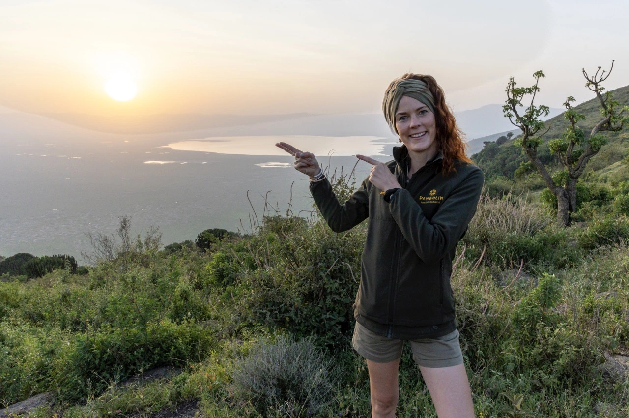 Ngorongoro Crater photographer guide capturing wildlife and landscapes from a safari vehicle in Tanzania